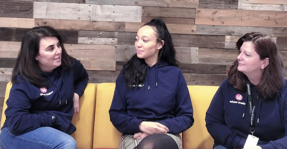 The US team talking in the Talent Works office